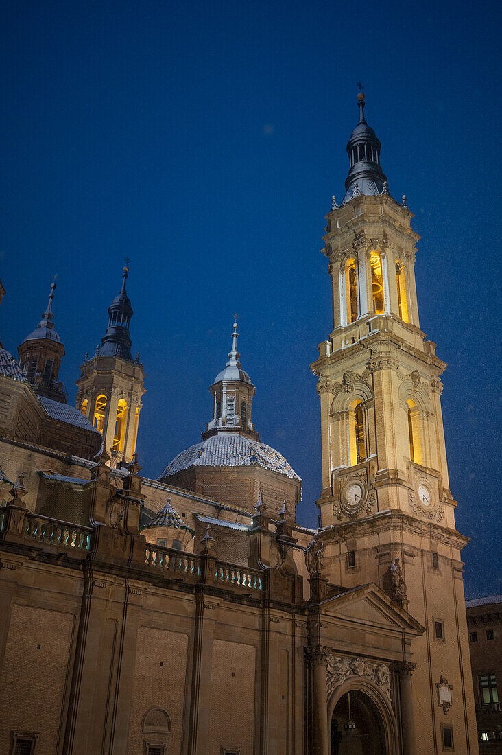 Snow falls over El Pilar Basilica during Storm Juan in Zaragoza, Spain