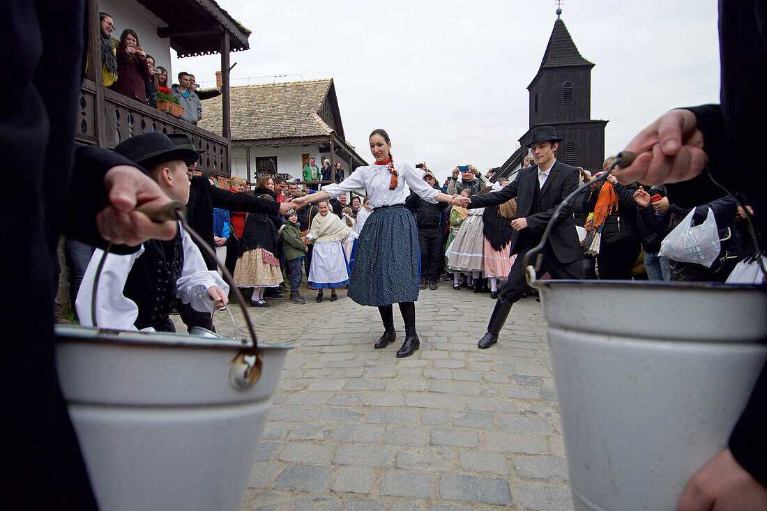 Water spraying ritual, traditional costumes and folk traditions at Easter Festival in Holl?k?, UNESCO World Heritage-listed village in the Cserh?t Hills of the Northern Uplands, Hungary.