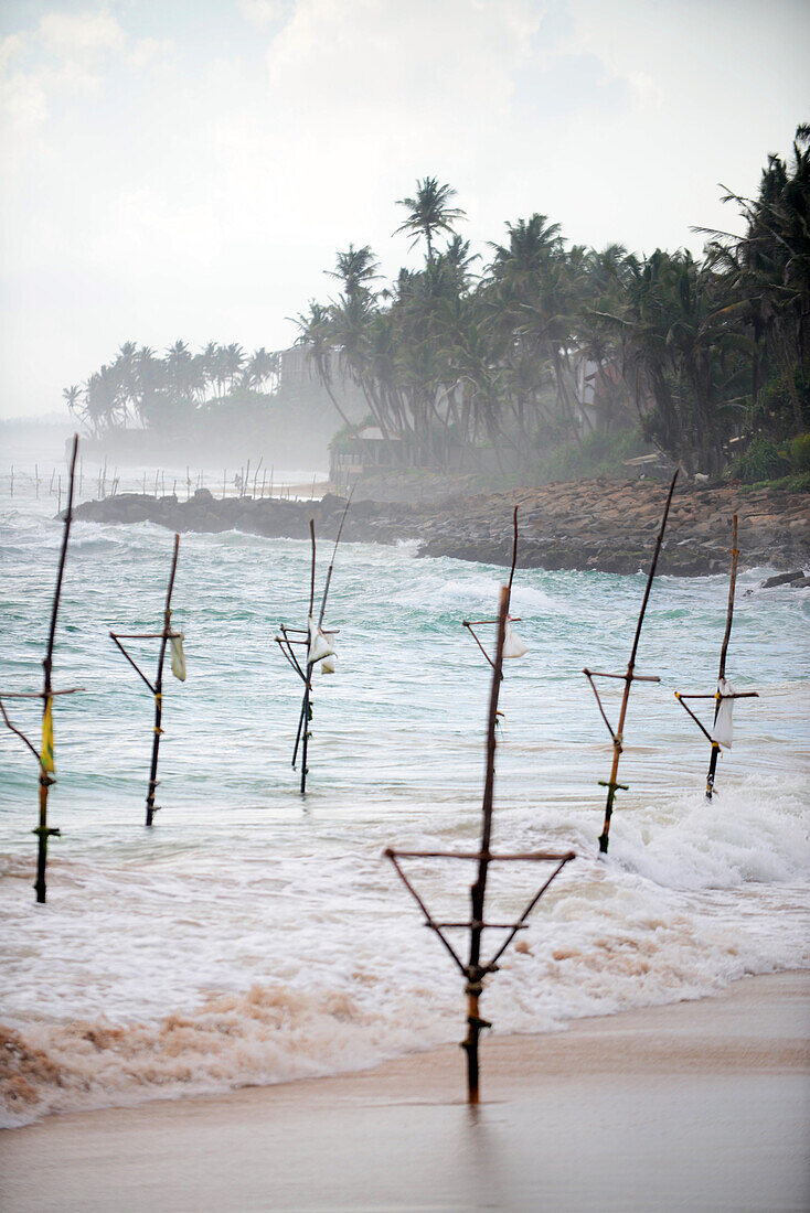Empty fishing stilts in Ahangama coast, Sri Lanka
