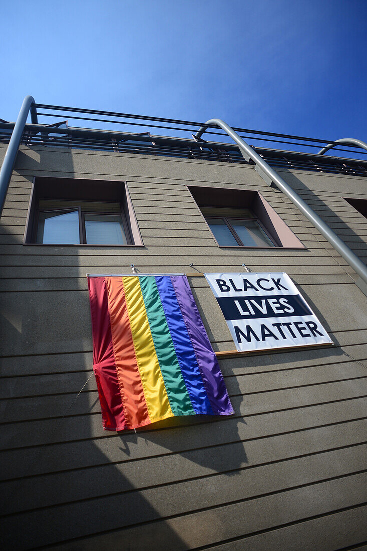 Black lives matter sign and gay flag on building. San Francisco, California.