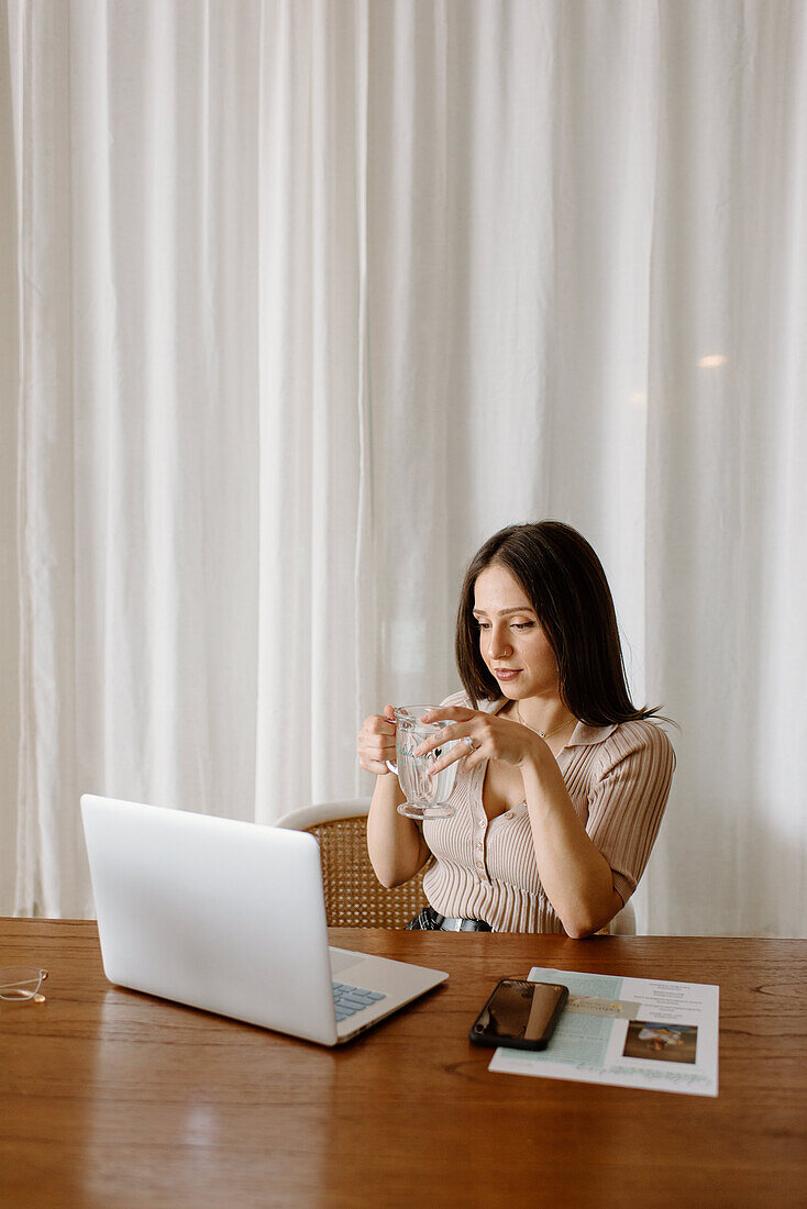 Young businesswoman working on laptop