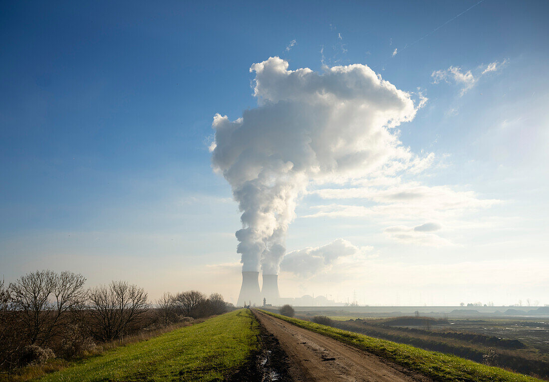 Steam rising from cooling towers of nuclear power plant