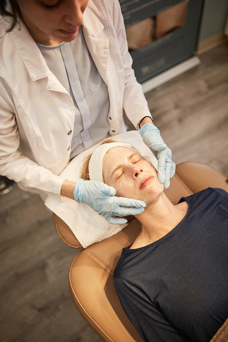 Overhead view of woman having face massage