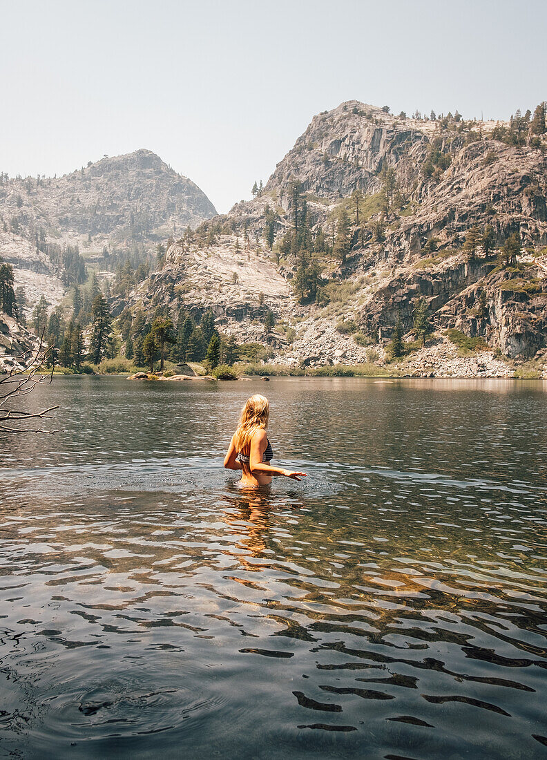 Woman standing in lake