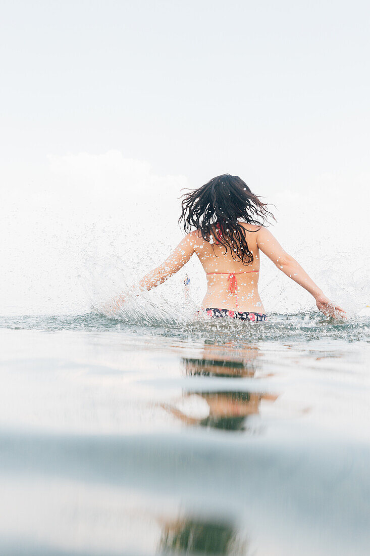 Woman running in lake