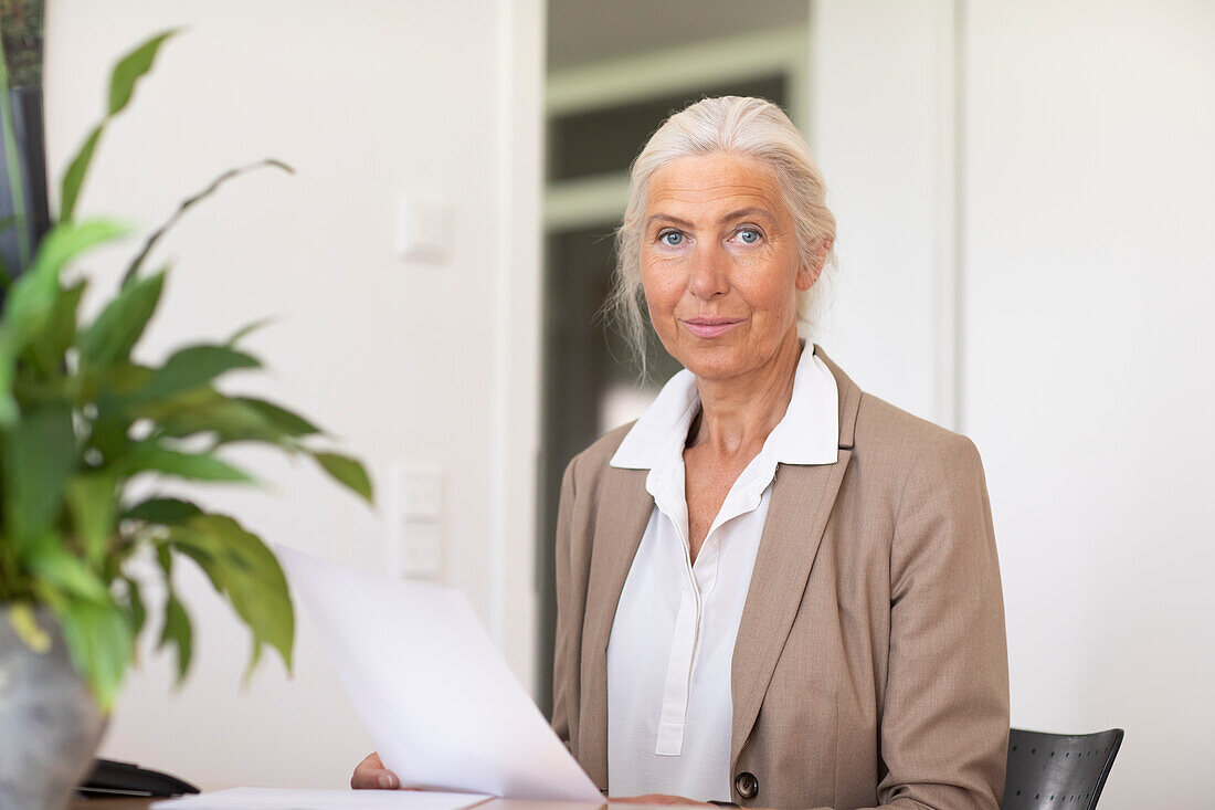 Portrait of mature businesswoman in office