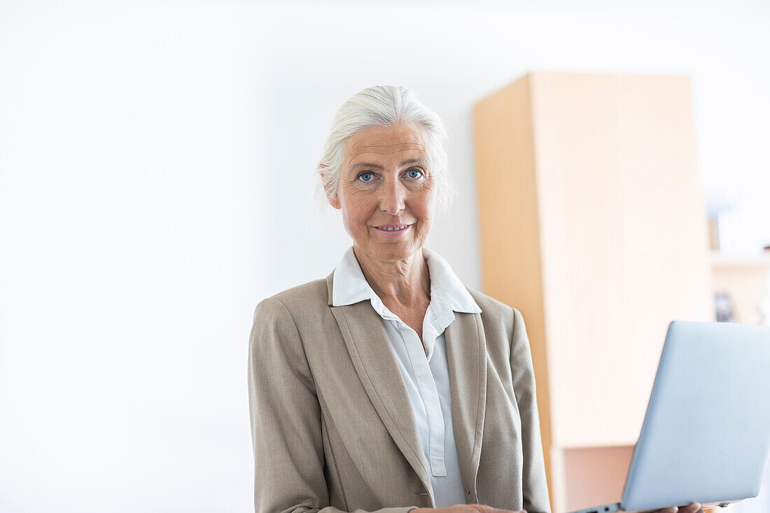 Portrait of mature businesswoman in office