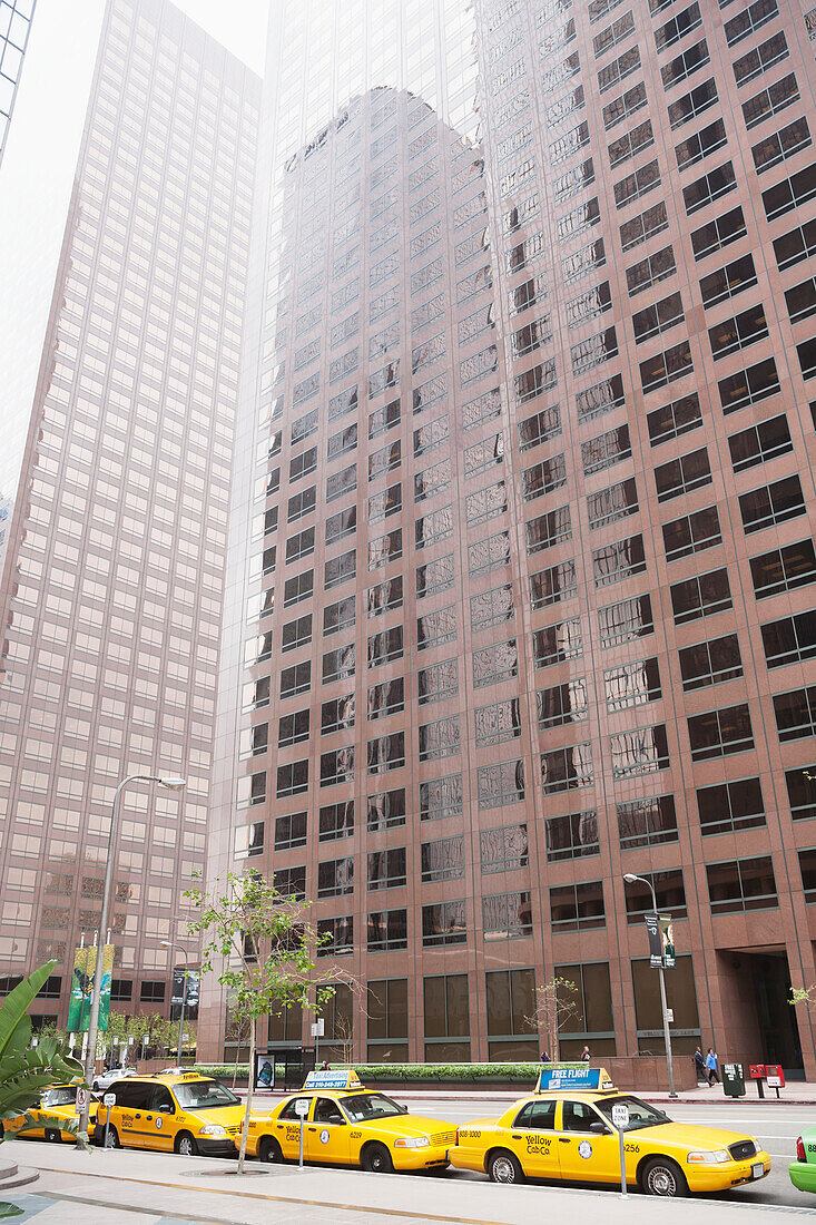 Skyscrapers And Taxis Lined Up On The Street; California, United States Of America