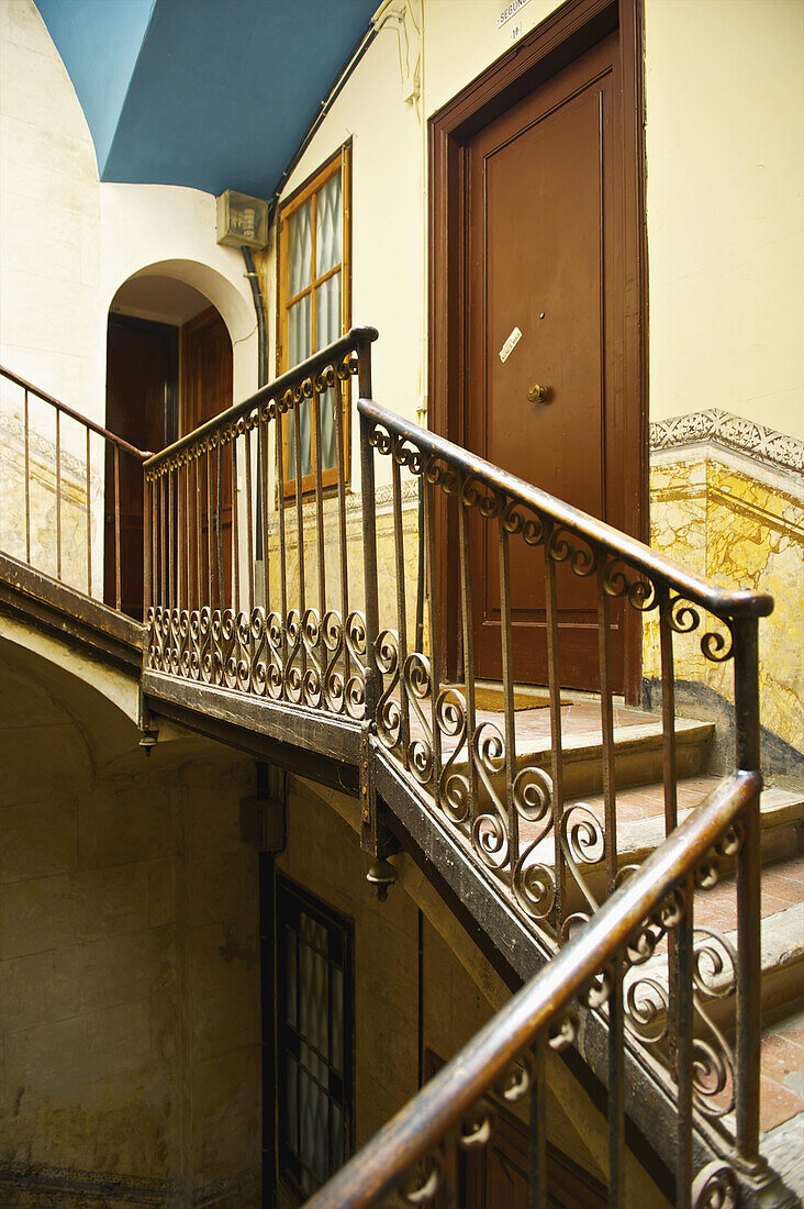 A Decorative Railing Outside A Residential Door And Entrance; Barcelona, Spain