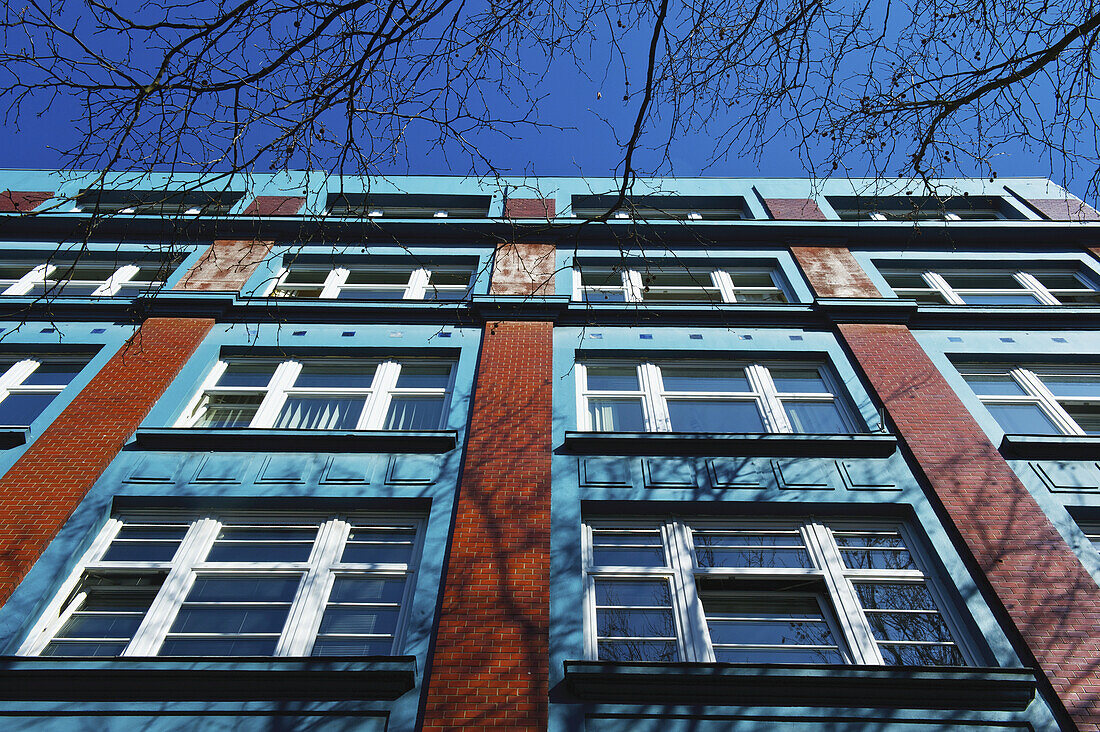 Low Angle View Of The Facade Of A Building With Windows Against A Blue Sky; Hamburg, Germany