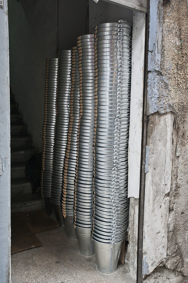 Piles Of Metal Pails Inside A Doorway; Istanbul, Turkey