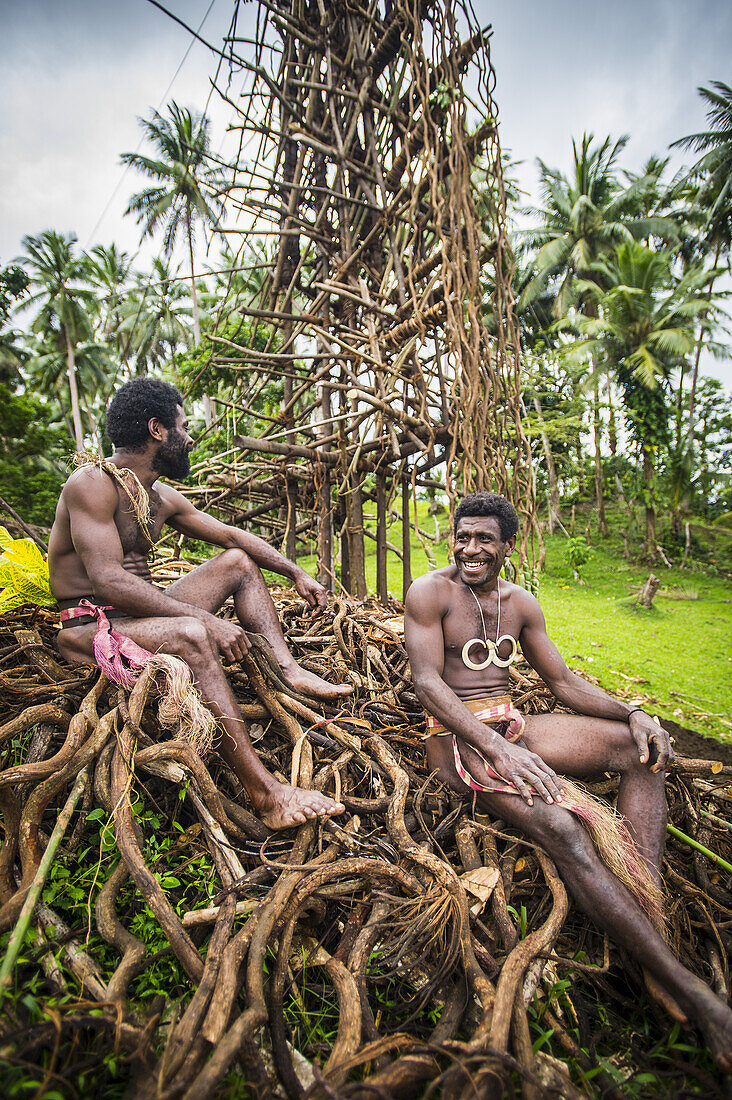 Pentecost Land Divers With Land Diving Tower In The Background; Pentecost Island, Vanuatu