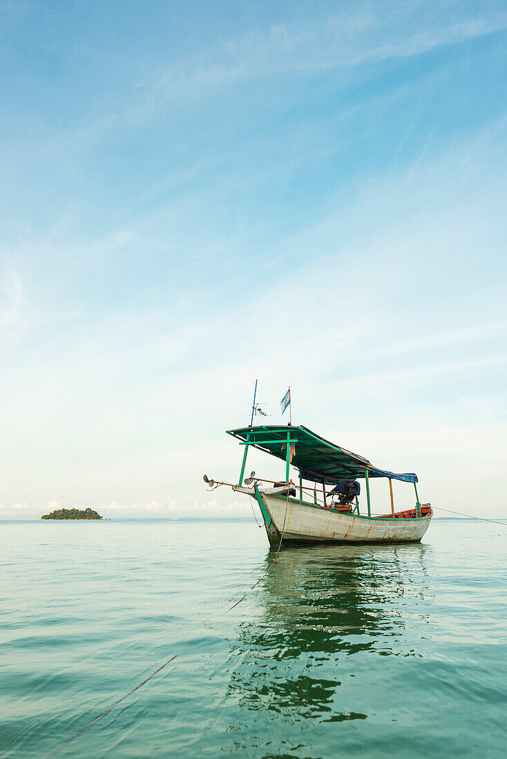 A Boat In The Tranquil Water Off Tui Beach, Koh Rong Island; Sihanoukville, Cambodia Cambodia