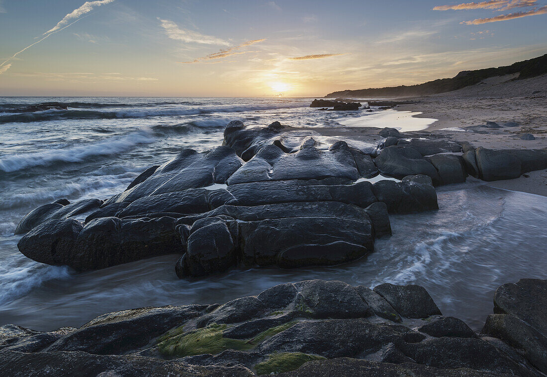 Sunset And Water Washing Up On The Shore; Tarifa, Cadiz, Andalusia, Spain