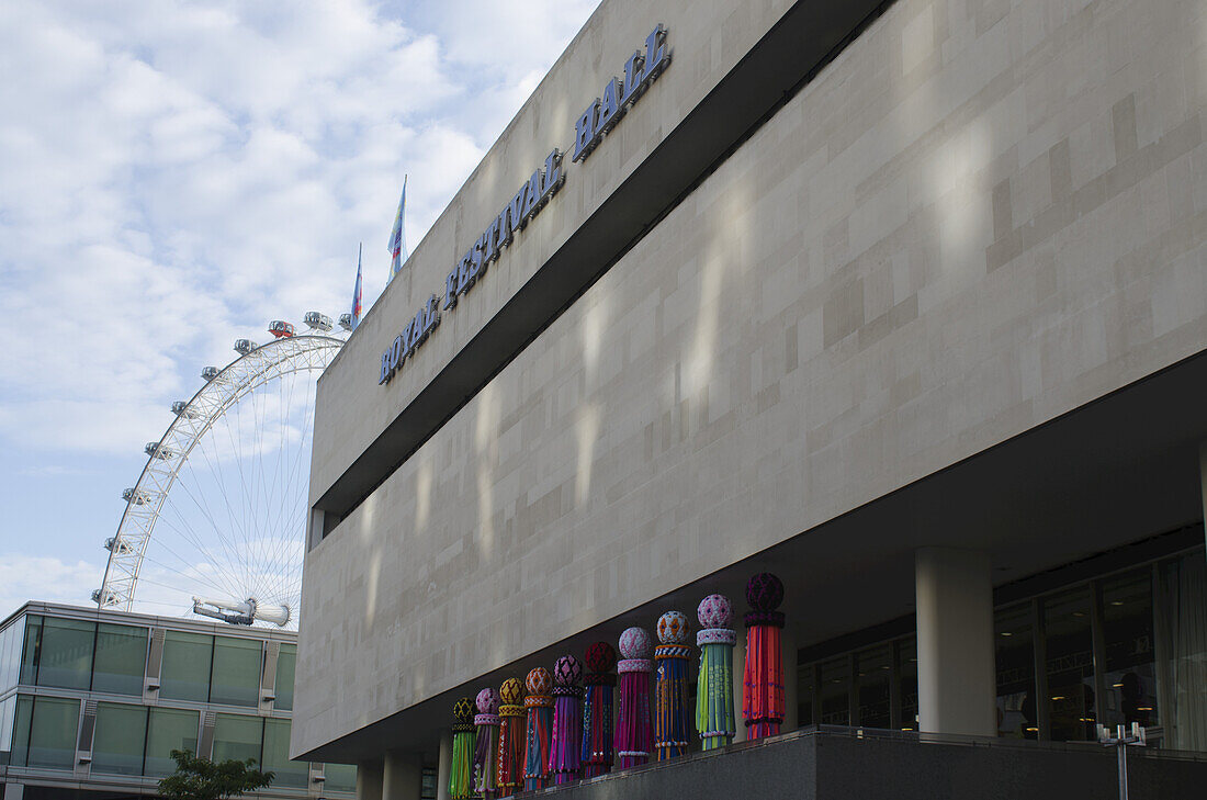 Exterior Of The Royal Festival Hall With The London Eye In The Background; London, England