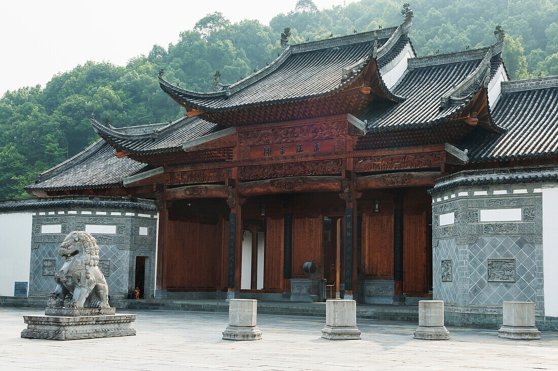 Building Of Traditional Chinese Architecture And A Lion Statue In A Small Village Near Wuyuan; Jiangxi Province, China