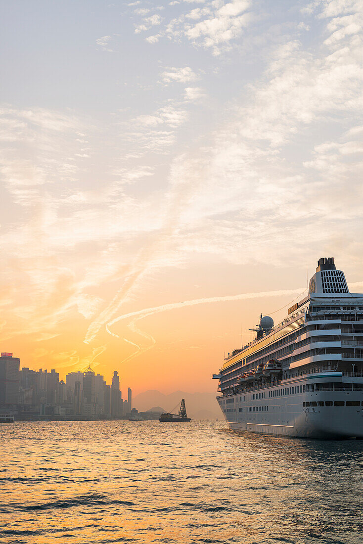 Cruise Ship In The Harbour At Sunset, Kowloon; Hong Kong, China