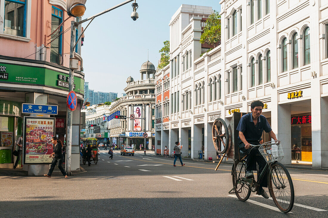 A Man Carries A Cart On His Bicycle In Xiamen's Downtown; Xiamen, Fujian Province, China