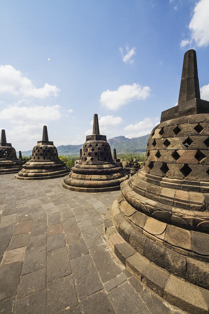 Latticed Stone Stupas Containing Buddha Statues On The Upper Terrace, Borobudur Temple Compounds, Central Java, Indonesia