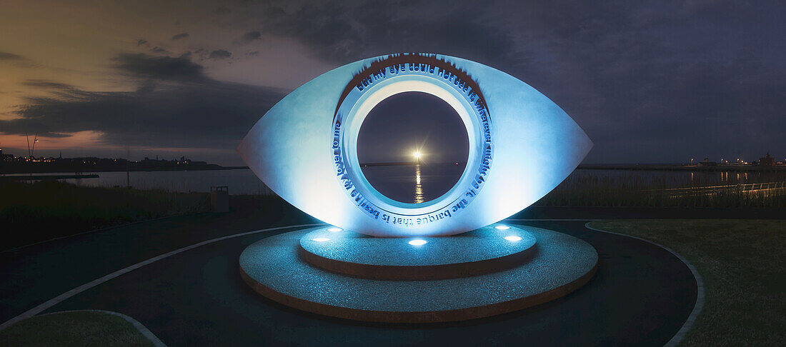 Eye Sculpture Illuminated With Blue Light At Sunset; South Shields, Tyne And Wear, England