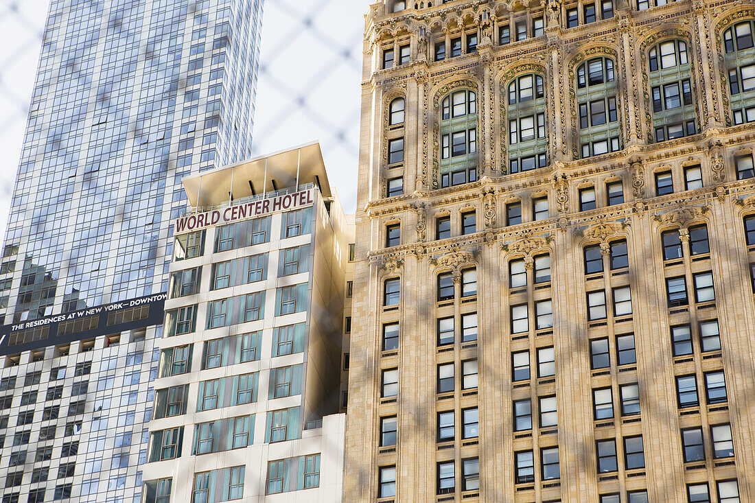 Buildings Behind Fence At World Trade Centre Memorial; New York City, New York, United States Of America