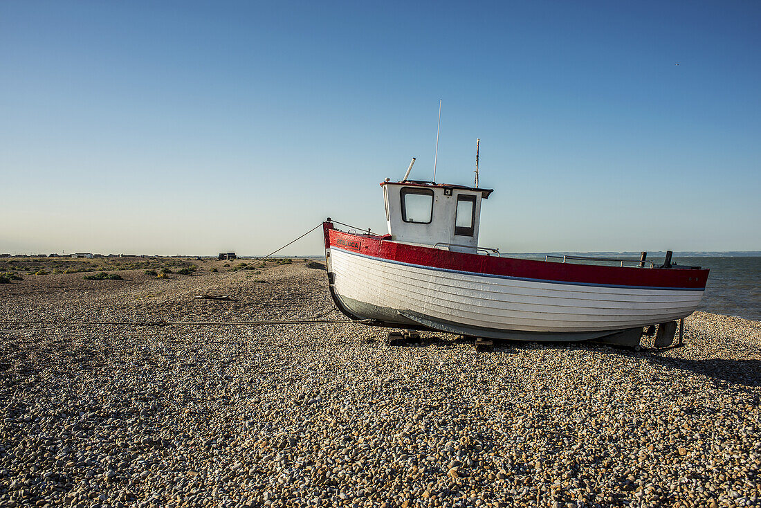 A Boat On A Shingle Beach; Dungeness, Kent, England