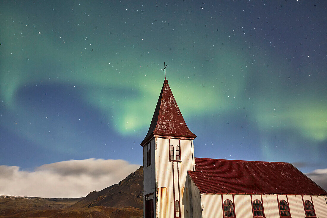 Northern Lights over a church in Hellnar, Snaefellsnes peninsula, west coast of Iceland; Hellnar, Iceland