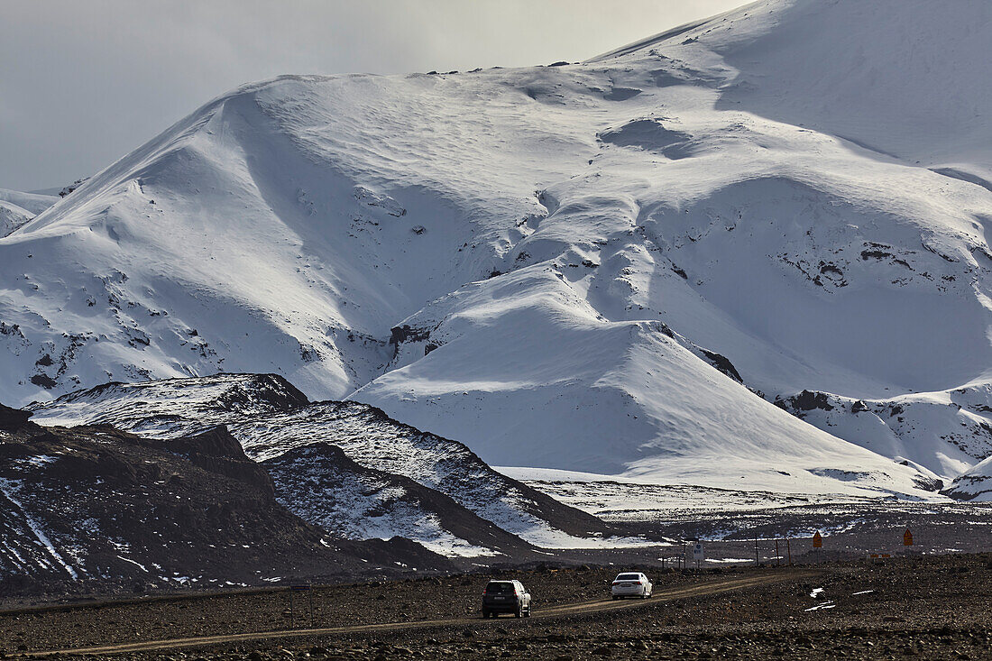 Vehicles travel route F550 in the western Highlands, leading to Langjokull Glacier and the Kaldidalur Valley, west Iceland; Iceland