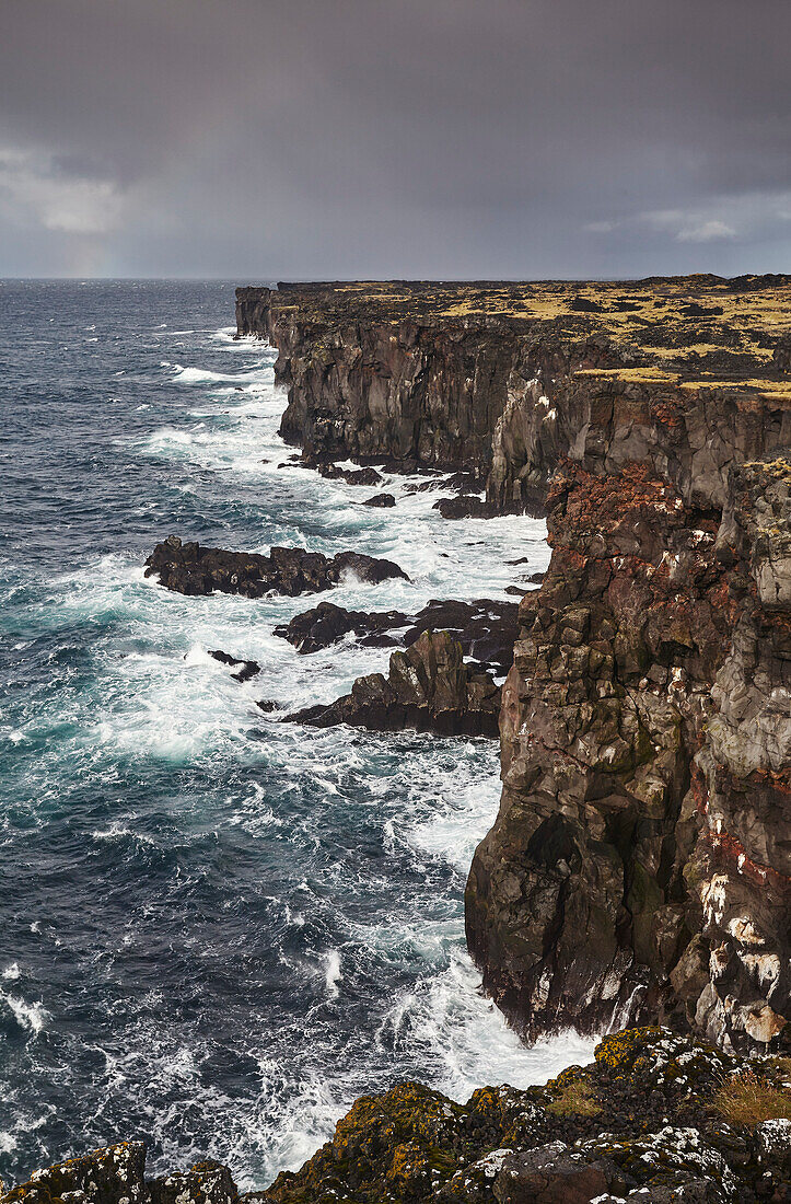 Lava cliffs at Skalasnagi, at the northwestern tip of the Snaefellsnes peninsula, western Iceland; Iceland