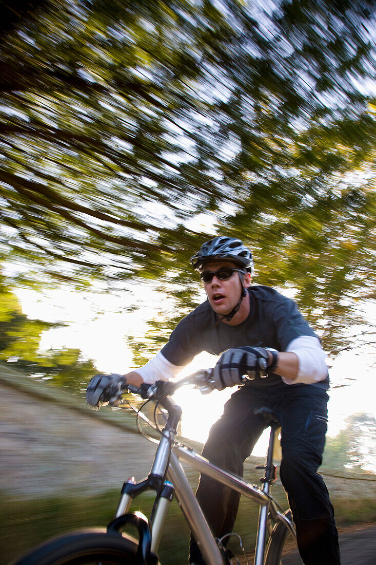 Man cycling on a country road