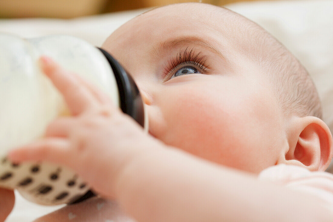 Close up of Baby Girl Drinking from Baby Bottle
