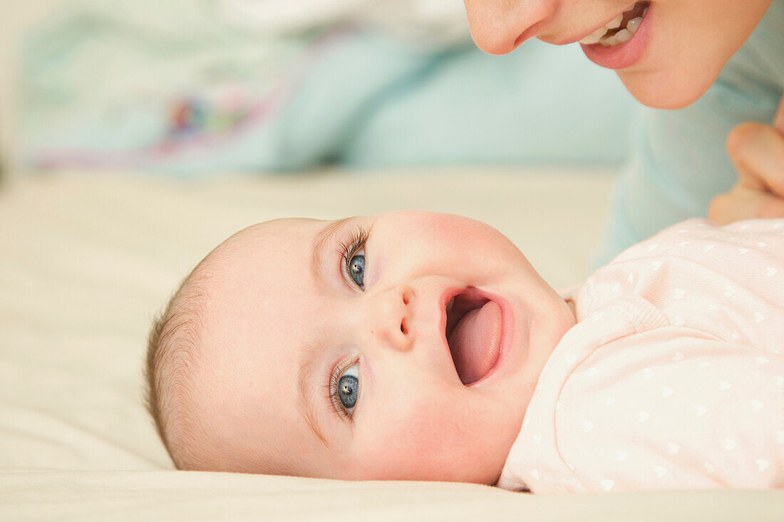 Smiling Baby with Mother, Close-up view