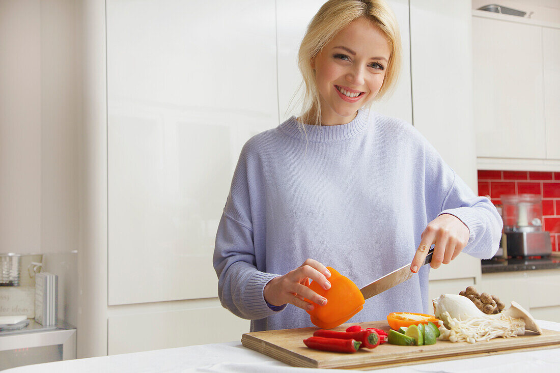 Smiling Woman Preparing Vegetables