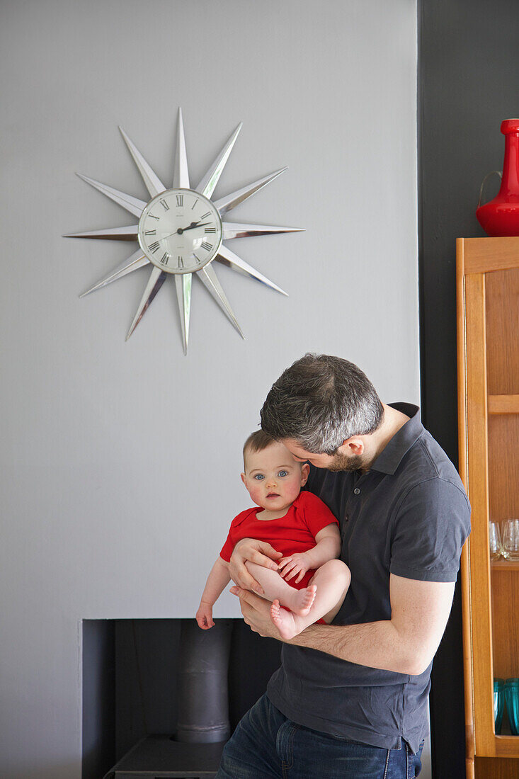 Father Holding Baby Girl