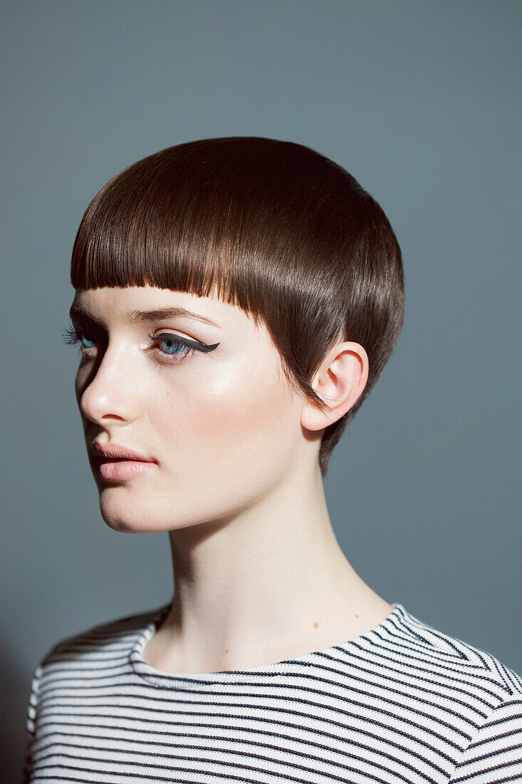 Young Woman with Blunt Fringe and Black Eyeliner