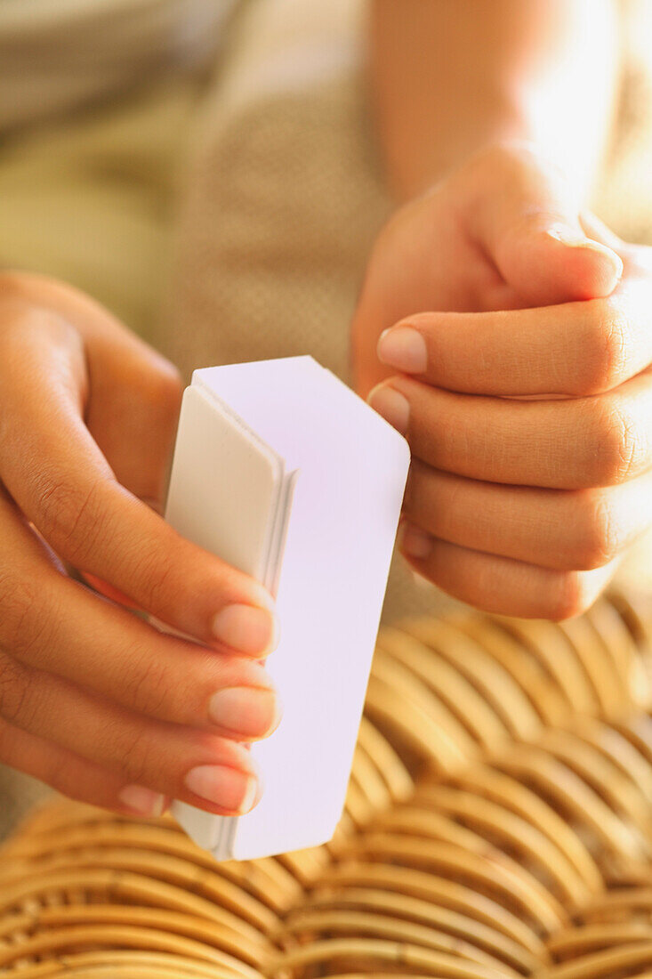 Woman Using Nail Buffer, Close-up View