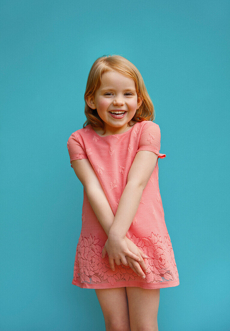 Smiling Young Girl against blur background 