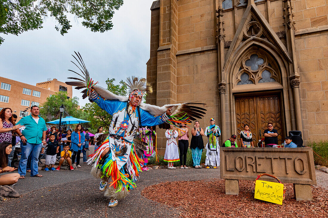 Santa Fe Indian Market participants in traditional regalia perform in downtown Santa Fe, New Mexico, United States of America, North America