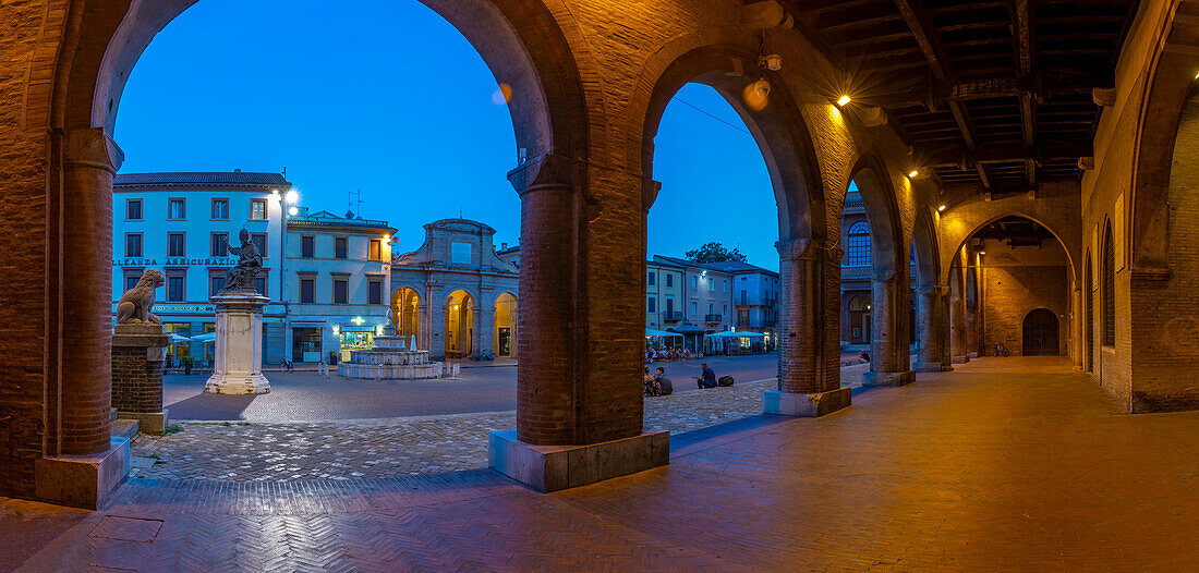 View of Piazza Cavour from arches of Palazzo del Podesta in Rimini at dusk, Rimini, Emilia-Romagna, Italy, Europe