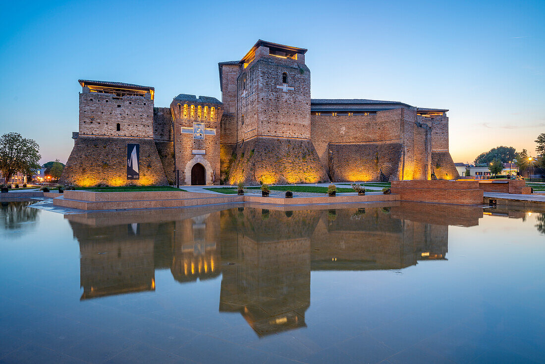 View of Castel Sismondo reflecting in ornamental water pool at dusk, Rimini, Emilia-Romagna, Italy, Europe