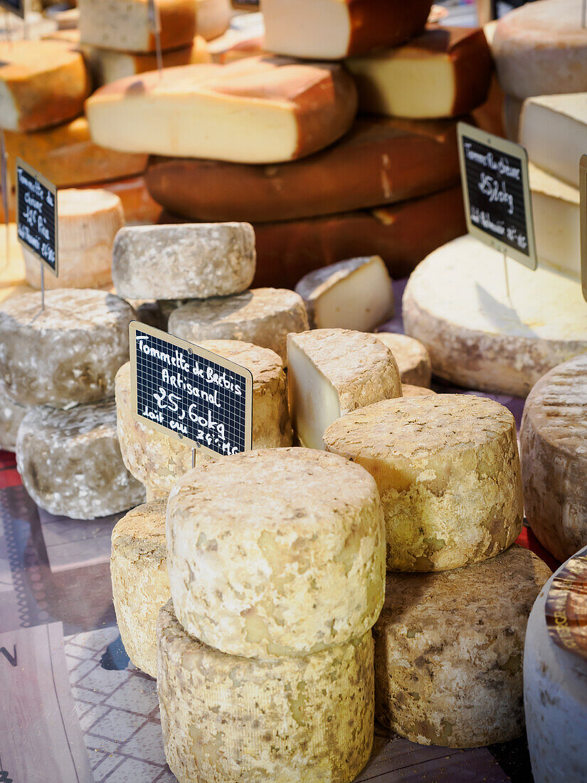 Cheeses on display at Annecy market, Annecy, Haute-Savoie, France, Europe