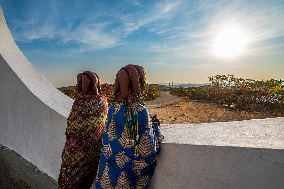Muila girls standing in the Christ the King Statue, overlooking Lubango, Angola, Africa