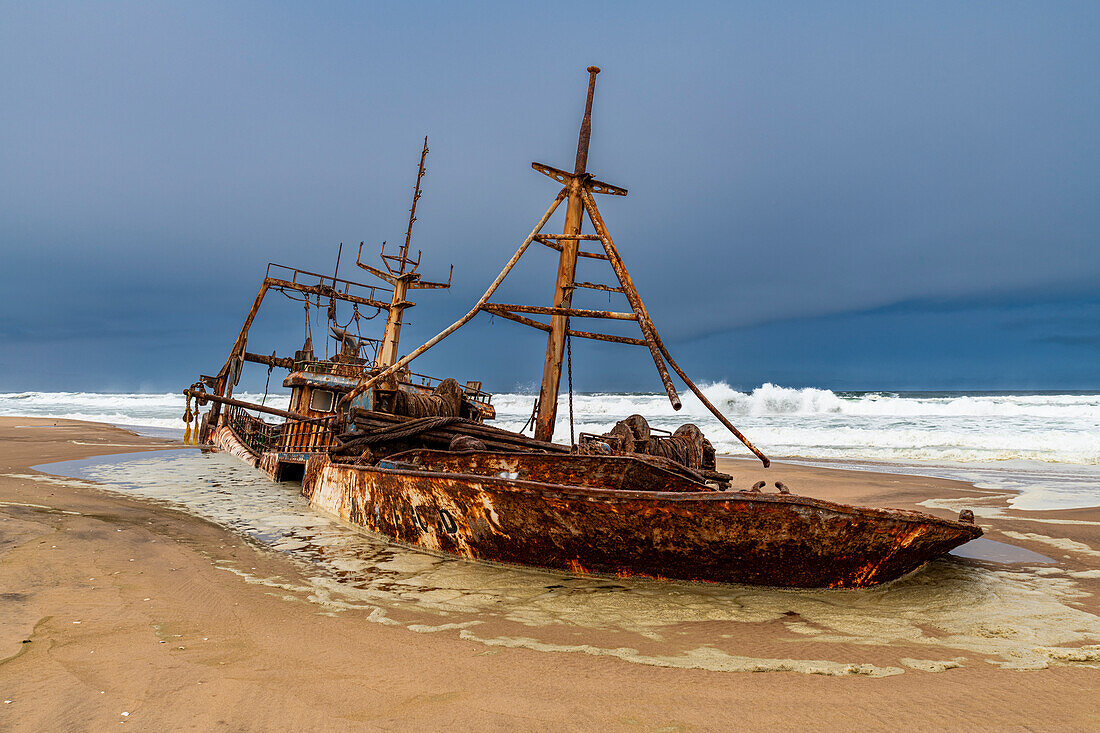 Shipwreck on a beach in the Iona National Park, Namibe, Angola, Africa