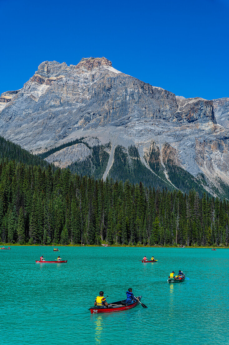 Tourists in canoes, Emerald Lake, Yoho National Park, UNESCO World Heritage Site, British Columbia, Canada, North America