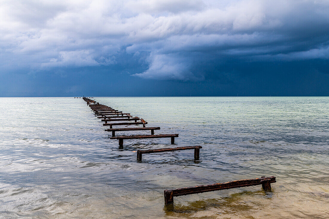 Destroyed pier at a Luxury hotel in Hotel el Colony before a storm, Isla de la Juventud (Isle of Youth), Cuba, West Indies, Central America