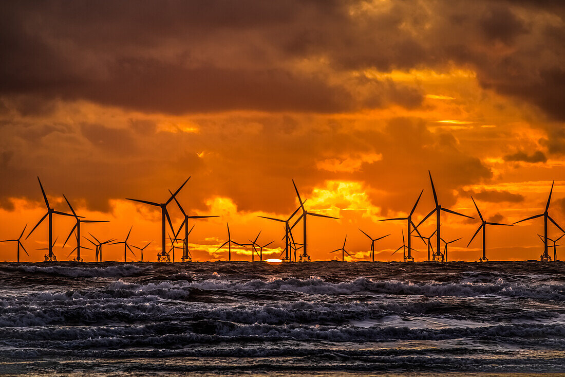 Sunset view over the Irish Sea towards the distant Walney Offshore wind farm, Walney Island, Cumbrian Coast, Cumbria, England, United Kingdom, Europe