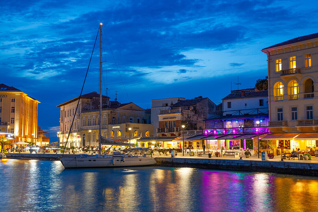 Boat and waterfront restaurants in the evening, Harbor, Porec, Croatia, Europe