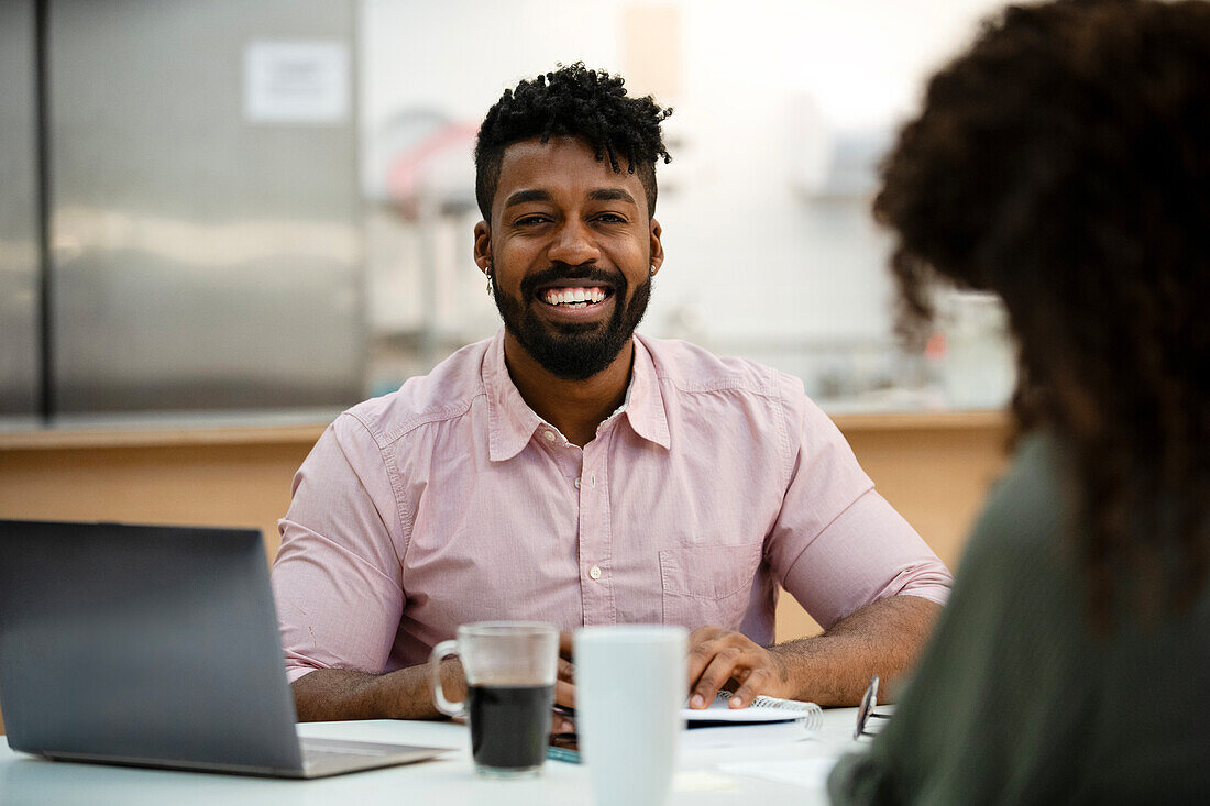 Adult businessman looking at the camera during meeting