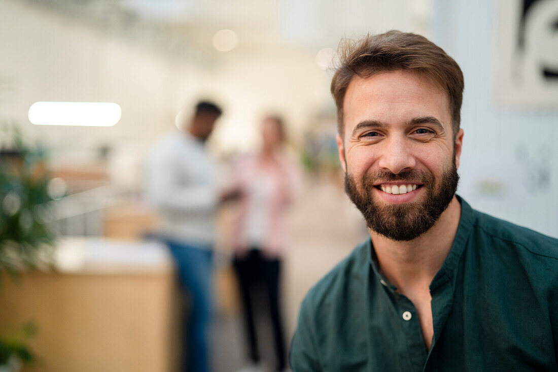 Adult man smiling and looking at the camera