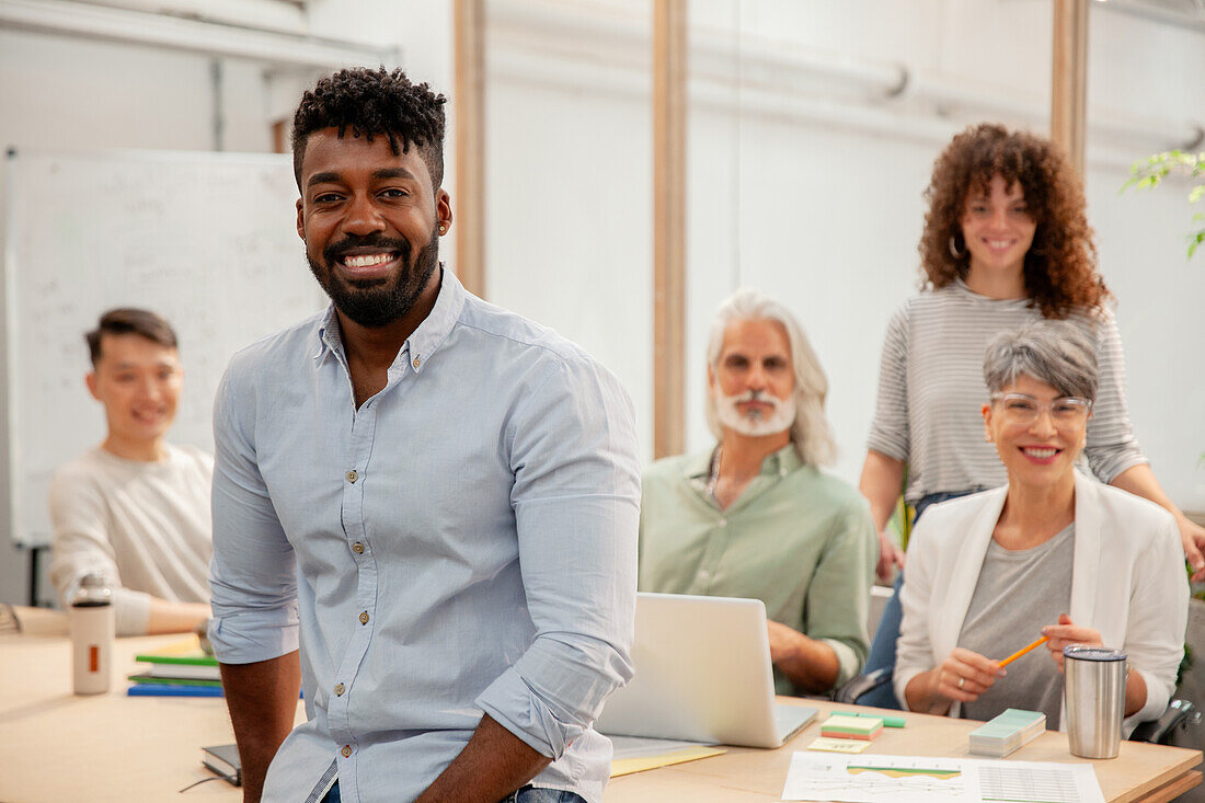 African American businessman looking at the camera while standing in office